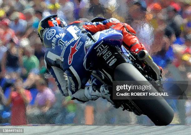 Spain's Jorge Lorenzo of the Yamaha team steers his bike during the qualifying of the Moto Grand Prix at the Sachsenring Circuit on July 16, 2011 in...