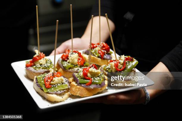 close-up of waitress with tray of spanish tapas - pinchos stock-fotos und bilder