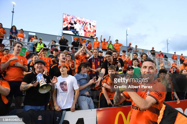 Scott Neville of the Roar celebrates with fans after his team's victory during the round A-League Mens match between Brisbane Roar and Wellington...