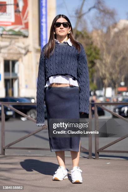 Alessandra Airo wearing a grey cropped sweater, grey midi skirt and white Miu Miu sneakers, is seen outside Miu Miu, during Paris Fashion Week -...