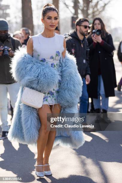 Camila Coelho wearing a light blue embellished mini dress, light blue fur coat, Miu Miu white bag and silver heels, is seen outside Miu Miu, during...