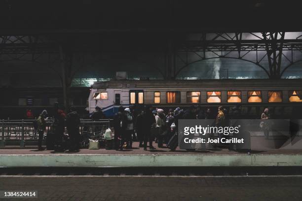 people waiting for a train in lviv, ukraine - ukraine stockfoto's en -beelden