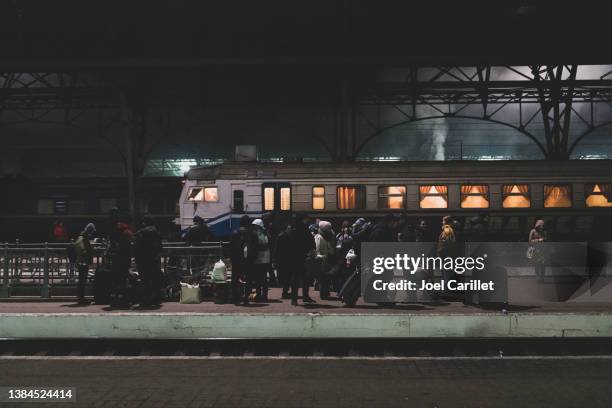 people waiting for a train in lviv, ukraine - ukraine imagens e fotografias de stock