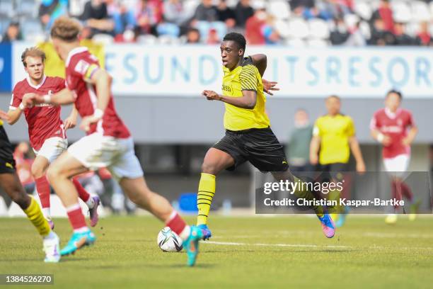 Abdoulaye Kamara of Borussia Dortmund U19 runs with the ball during the DFB Juniors Cup semi final match between SC Freiburg U19 and Borussia...