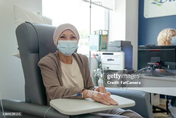 woman receiving cancer treatment - chemo stock pictures, royalty-free photos & images