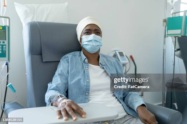 senior woman receiving cancer treatment - chemotherapy drug stock pictures, royalty-free photos & images