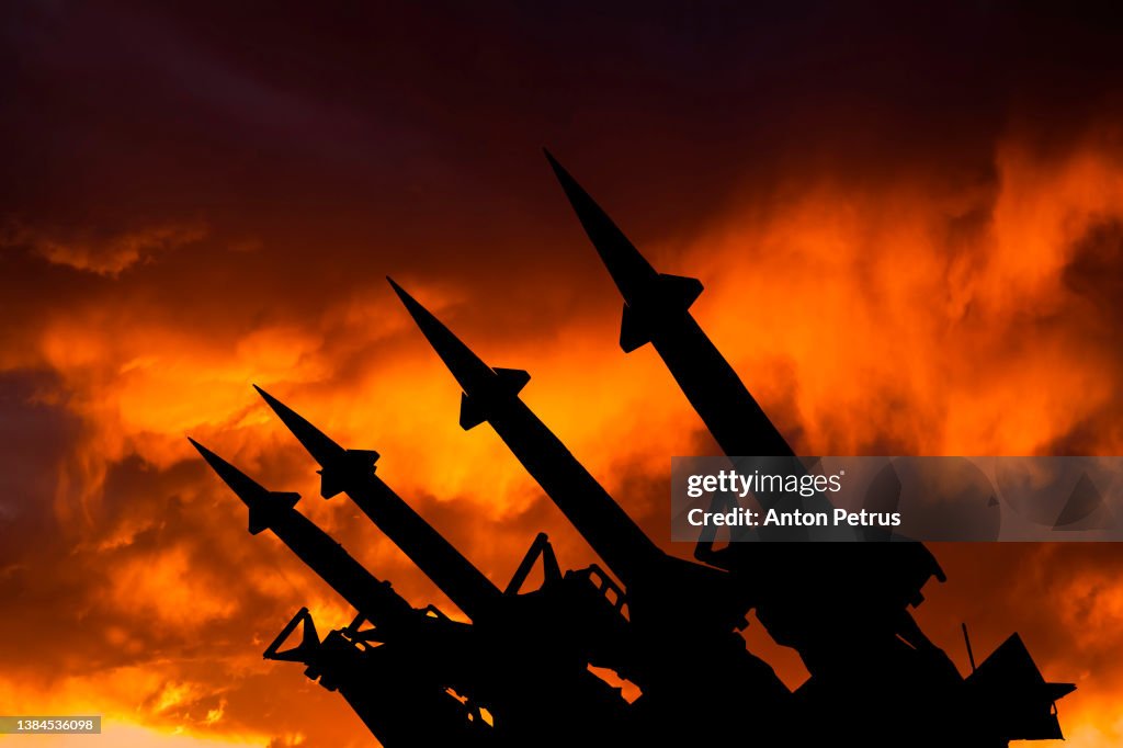 Threat of nuclear war. Missile system on the background of sunset sky