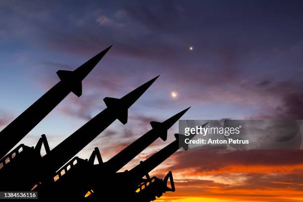 threat of nuclear war.  missile system on the background of sunset sky - hydrogen bomb stock pictures, royalty-free photos & images