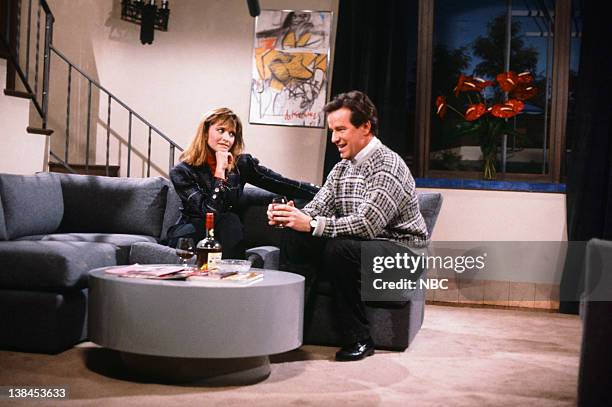 Episode 9 -- Pictured: Jan Hooks as Leslie, Phil Hartman as Dan during "The Honest Man" skit on January 24, 1987