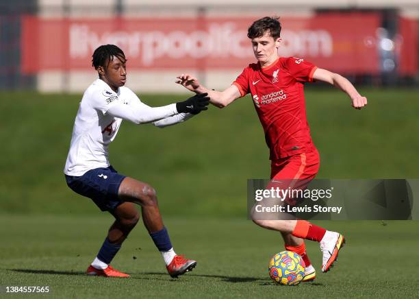 Tyler Morton of Liverpool battles for possession with Romaine Mundle of Tottenham Hotspur during the Premier League 2 match between Liverpool and...