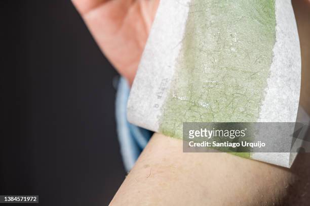 close-up of woman waxing her legs - waxing stock-fotos und bilder