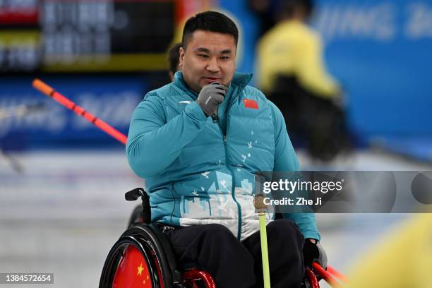 Haitao Wang of Team China competes during the Wheelchair Curling Gold Medal Game against Sweden on day eight of the Beijing 2022 Winter Paralympics...