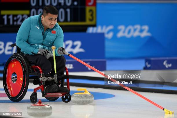 Haitao Wang of Team China competes during the Wheelchair Curling Gold Medal Game against Sweden on day eight of the Beijing 2022 Winter Paralympics...