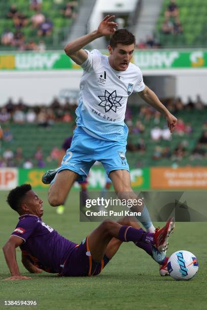 Antonee Burke-Gilroy of the Glory tackles Max Burgess of Sydney during the A-League Mens match between Perth Glory and Sydney FC at HBF Stadium, on...