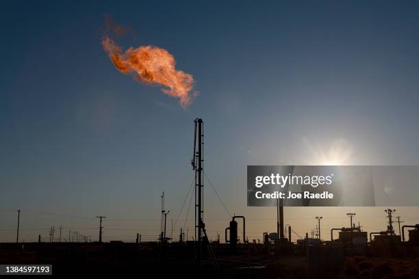 Natural gas is flared off during an oil drilling operation in the Permian Basin oil field on March 12, 2022 in Midland, Texas. President Joe Biden...