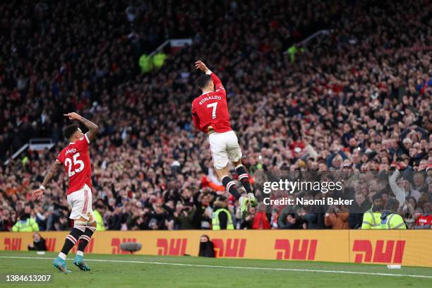 Cristiano Ronaldo of Manchester United celebrates after scoring their side's first goal during the Premier League match between Manchester United and...