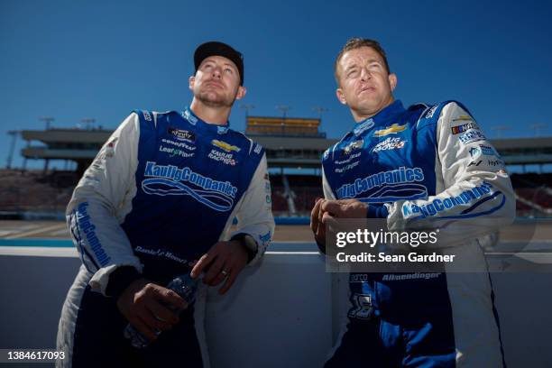 Daniel Hemric, driver of the AG1 - Athletic Greens Chevrolet, and AJ Allmendinger, driver of the Action Industries Chevrolet, look on during...