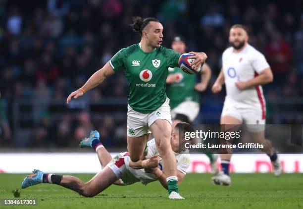 James Lowe of Ireland breaks with the ball from Henry Slade of England during the Guinness Six Nations Rugby match between England and Ireland at...