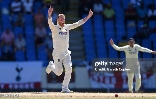 Ben Stokes of England celebrates dismissing Kraigg Brathwaite of the West Indies during day five of the first test match between West Indies and...