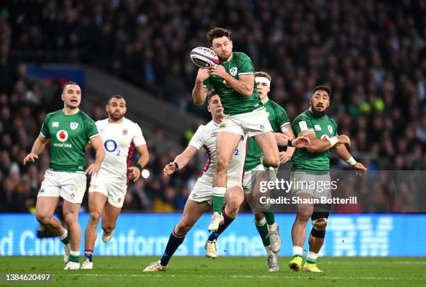 Hugo Keenan of Ireland is challenged by Freddie Steward of England during the Guinness Six Nations Rugby match between England and Ireland at...