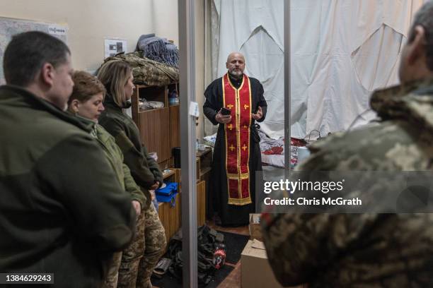 Territorial Defense unit, chaplain and combat paramedic Yevhen gives a special prayer service for soldiers and civilians that have been killed since...