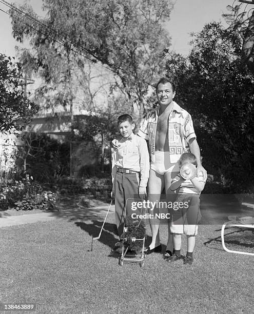 Pictured: Son Nico "Nicky" Charisse, actor/singer Tony Martin, son Tony Martin Jr. At home in 1954