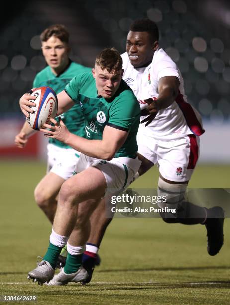 Jack Boyle of Ireland is tackled by Emeka Ilione of England during the Under-20 Six Nations match between England U20 and Ireland U20 at StoneX...