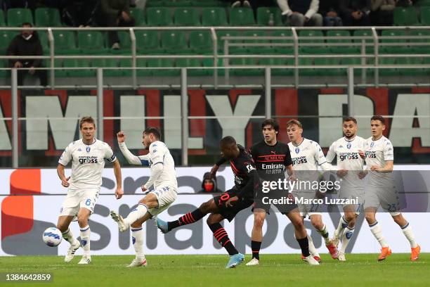 Pierre Kalulu of AC Milan scores their team's first goal during the Serie A match between AC Milan and Empoli FC at Stadio Giuseppe Meazza on March...