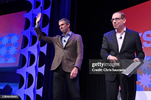 Beto O'Rourke and Evan Smith walk onstage at 'Beto O'Rourke in Conversation with Evan Smith ' during the 2022 SXSW Conference and Festivals at Hilton...