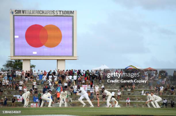 Jason Holder of the West Indies defends the ball surrounded by England close fielders during day five of the first test match between West Indies and...