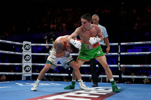 Michael Conlan punches Leigh Wood during the WBA World Featherweight Title fight between Leigh Wood and Michael Conlan at Motorpoint Arena Nottingham...