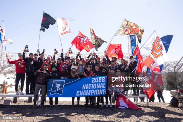 The University of Utah Utes are presented with the championship trophy after winning NCAA Skiing Championships on March 12, 2022 in Midway, Utah.