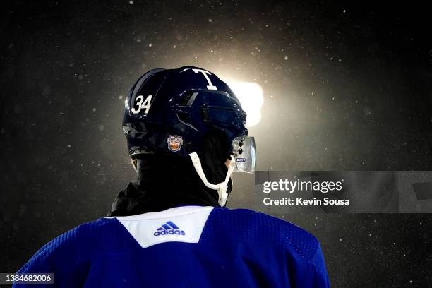Auston Matthews of the Toronto Maple Leafs looks on during practice ahead of the 2022 Tim Hortons NHL Heritage Classic at Tim Hortons Field on March...