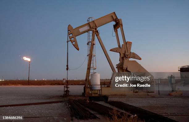 An oil pumpjack works in the Permian Basin oil field on March 12, 2022 in Stanton, Texas. United States President Joe Biden imposed a ban on Russian...