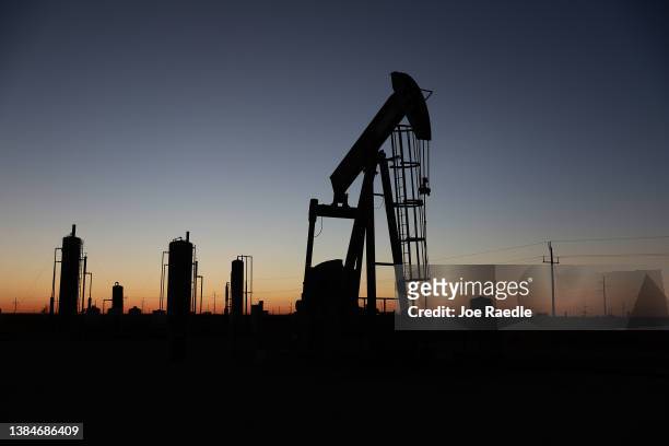 An oil pumpjack works in the Permian Basin oil field on March 12, 2022 in Stanton, Texas. United States President Joe Biden imposed a ban on Russian...