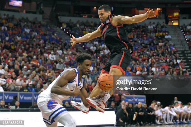Abu Kigab of the Boise State Broncos steals the ball from Lamont Butler of the San Diego State Aztecs during the championship game of the Mountain...