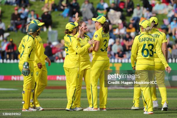 Amanda-Jade Wellington of Australia celebrates with teammates after dismissing Hayley Jensen of New Zealand during the 2022 ICC Women's Cricket World...