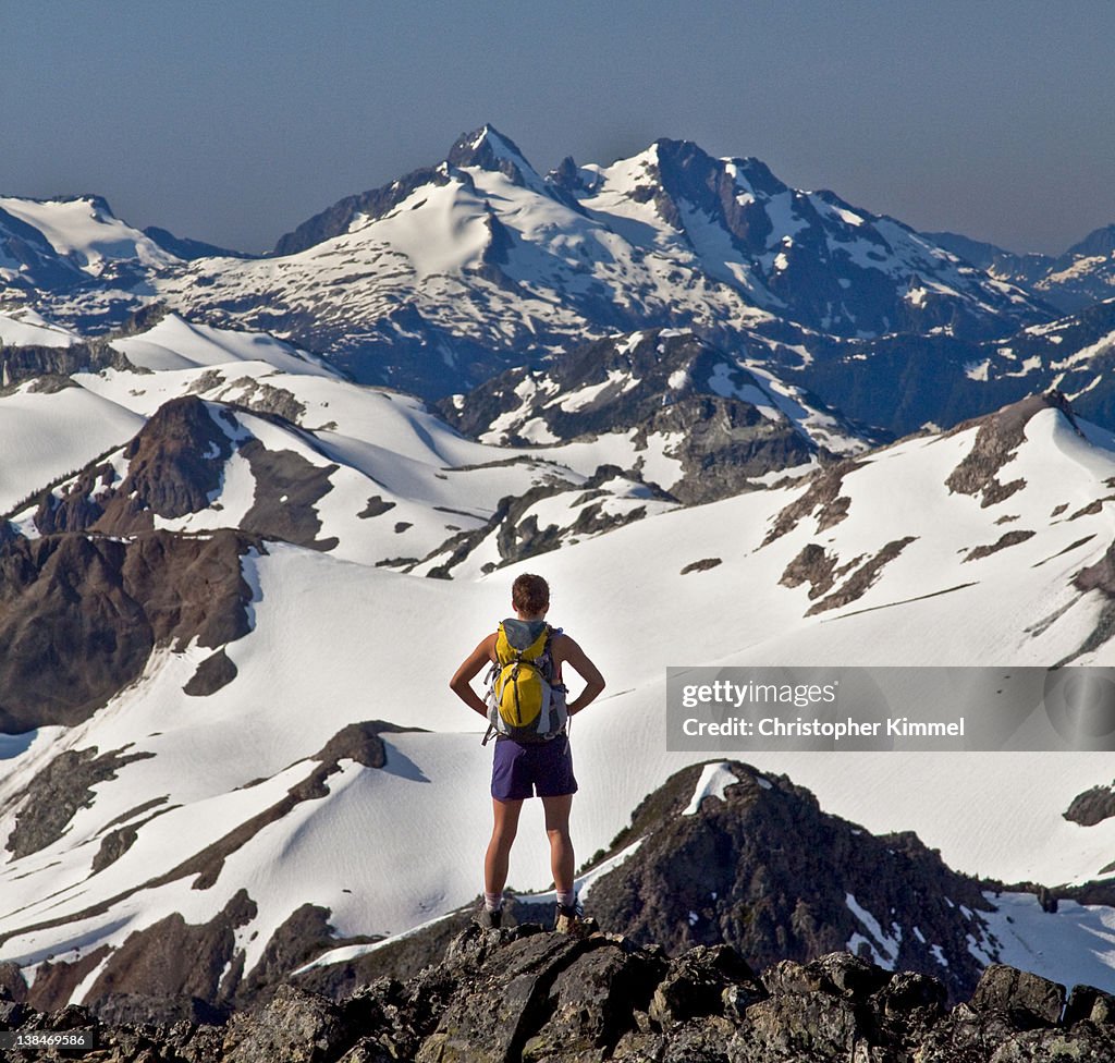 Woman backpacker on rocky ridge