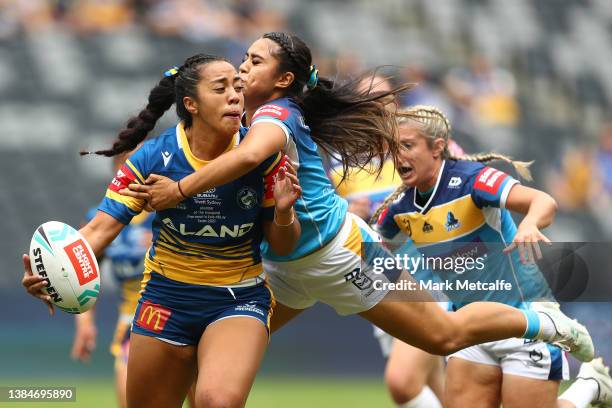 Elli Johnston of the Eels is tackled during the round three NRLW match between the Parramatta Eels and the Gold Coast Titans at CommBank Stadium, on...