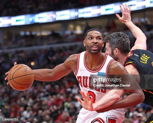 Tristan Thompson of the Chicago Bulls is fouled by Kevin Love of the Cleveland Cavaliers at the United Center on March 12, 2022 in Chicago, Illinois....