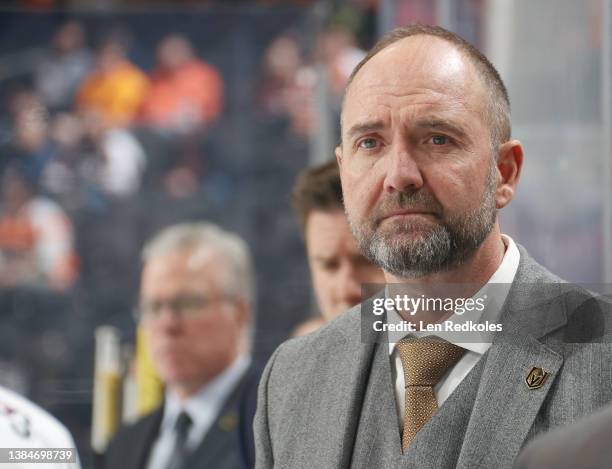 Head Coach of the Vegas Golden Knights Peter DeBoer looks on from his bench during the first period against the Philadelphia Flyers at the Wells...