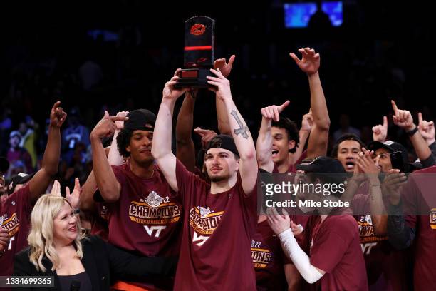 Hunter Cattoor of the Virginia Tech Hokies celebrates after winning the MVP against the Duke Blue Devils to win the 2022 Men's ACC Basketball...