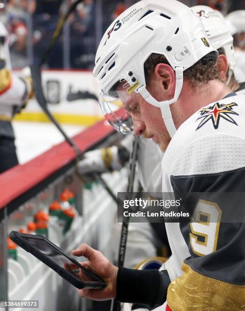 Jack Eichel of the Vegas Golden Knights reviews a play on an iPad from his bench during the first period against the Philadelphia Flyers at the Wells...