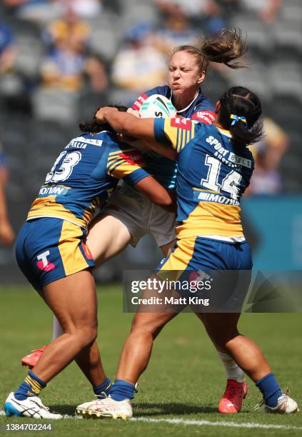 Karina Brown of the Titans is tackled during the round three NRLW match between the Parramatta Eels and the Gold Coast Titans at CommBank Stadium, on...