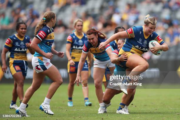 Ellie Johnston of the Eels is tackled during the round three NRLW match between the Parramatta Eels and the Gold Coast Titans at CommBank Stadium, on...