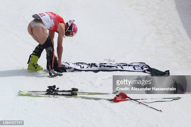 Manoel Bourdenx of Team France displays a message following the Para Alpine Skiing Men's Slalom Standing during day nine of the Beijing 2022 Winter...