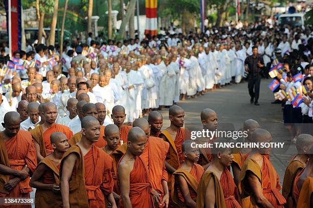 Cambodian Buddhist monks, nuns and people march during the Meak Bochea ceremony at Oddong mountain in Kandal province, some 40 kilometers north of...