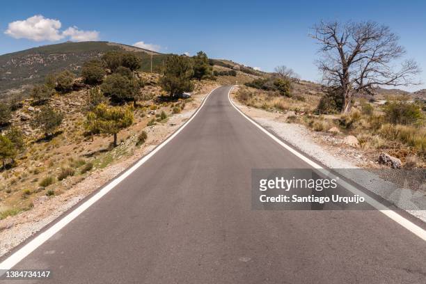 mountain road through region of las alpujarras - andalucian sierra nevada stock pictures, royalty-free photos & images