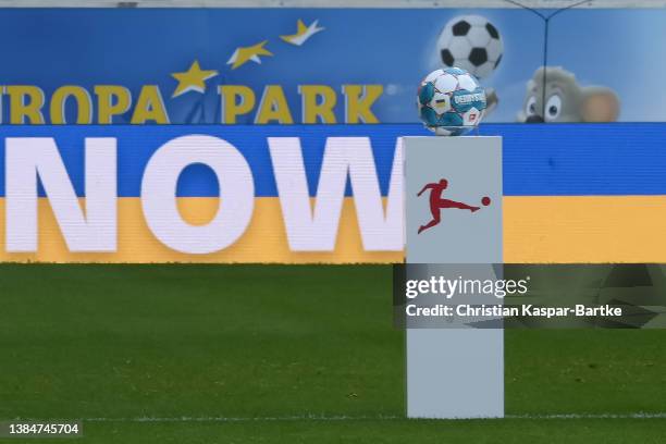 Board in Ukraine colors is seen prior tog the Bundesliga match between Sport-Club Freiburg and VfL Wolfsburg at Europa-Park Stadion on March 12, 2022...