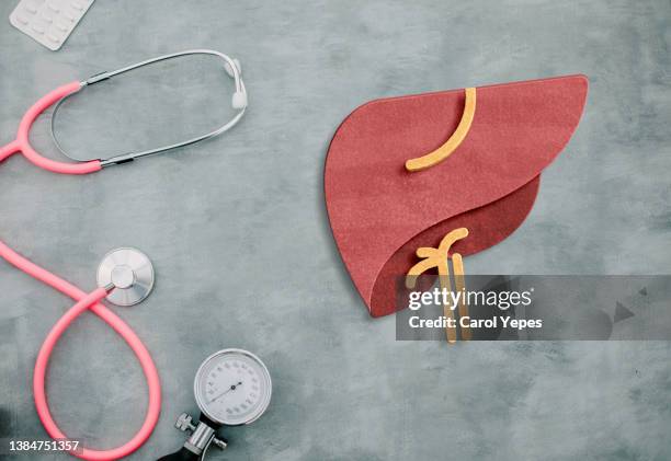 conceptual image of liver diseases like hepatitis with medical items - liver stock pictures, royalty-free photos & images